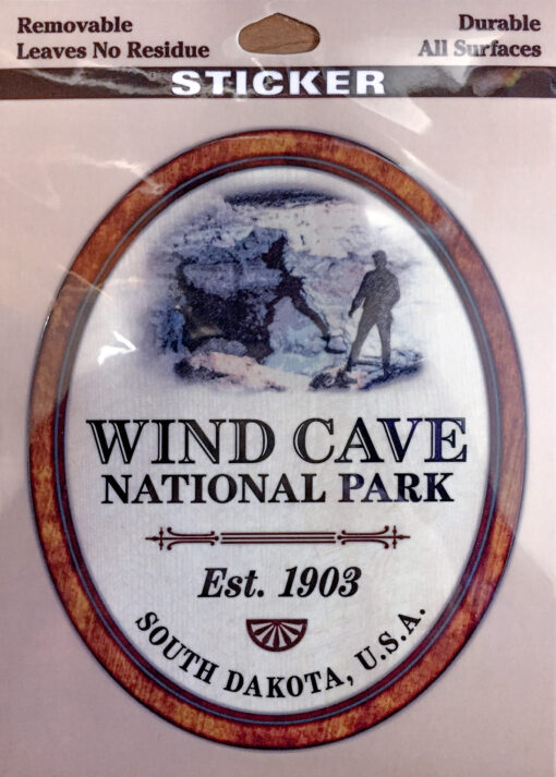 Oval sticker on a rectangular background. White with a red border. Text reads "Wind Cave National Park."
