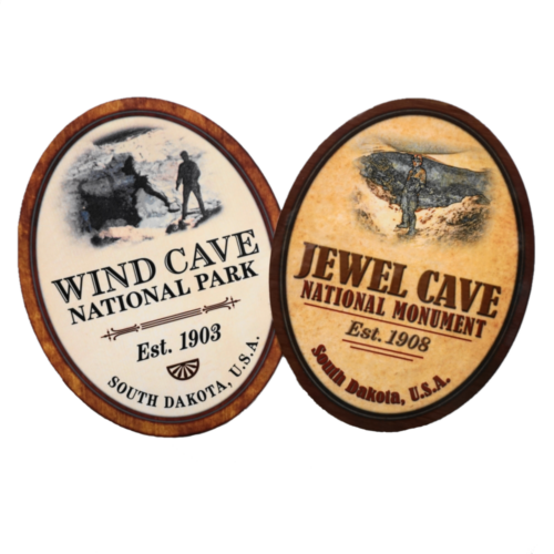 Wind Cave and Jewel Cave stickers. Two tall ovals with red borders. One with "Wind Cave National Park" and one with "Jewel Cave National Monument"