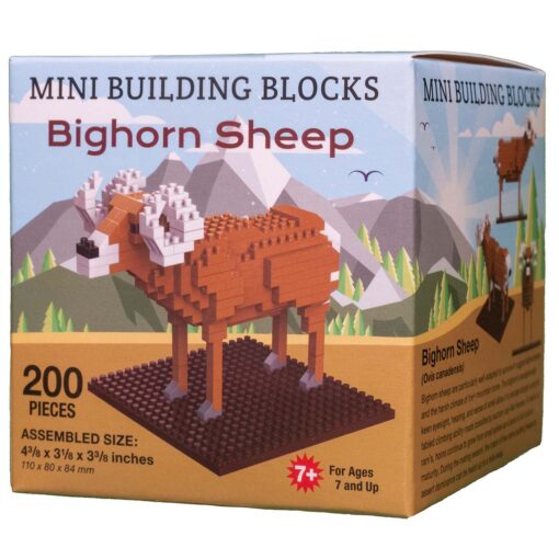 The image shows a product box for Bighorn sheep building blocks, featuring a Bighorn Sheep model. The front of the box has an image of the completed Bighorn Sheep model, constructed from small block pieces. The model consists of 200 pieces and assembles to a size of 4¾ inches long, 3⅛ inches wide, and 3⅜ inches tall (approximately 110 x 80 x 84 mm). The background of the box illustration features mountains and trees, reflecting a natural, outdoor setting. A red icon notes the product is for ages 7 and up.