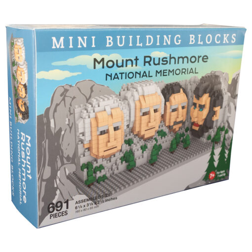 Blue rectangular box with 'lego' style display of the Mt Rushmore president faces. Text reads "Mini Building Blocks: Mount Rushmore National Memorial."