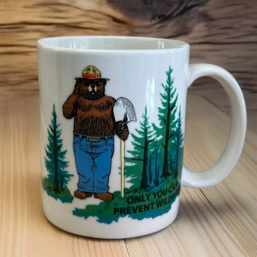 Smokey magic color changing mug in its "cold" state with full color green trees visible