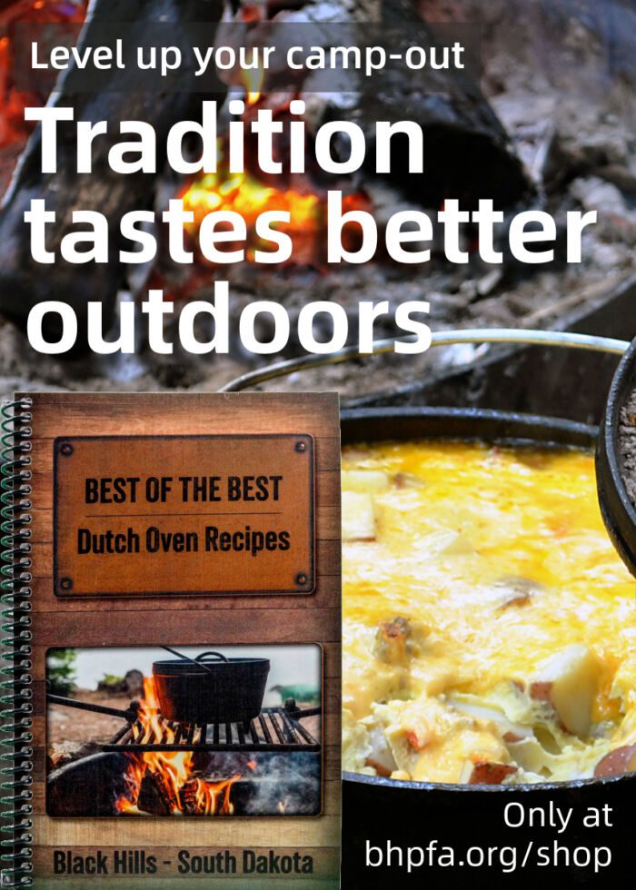 "Marketing graphic for a cookbook titled 'Best of the Best Dutch Oven Recipes.' The background shows a close-up of a Dutch oven cooking a cheesy potato dish over a campfire with glowing embers and logs. The top half of the image includes bold white and yellow text that reads: 'Level up your camp-out' and 'Tradition tastes better outdoors.' In the lower left, the front cover of the cookbook is shown. It features a photo of a black Dutch oven over an open flame and the title: 'BEST OF THE BEST Dutch Oven Recipes – Black Hills, South Dakota.' In the bottom right, white text reads: 'Only at bhpfa.org/shop.'"