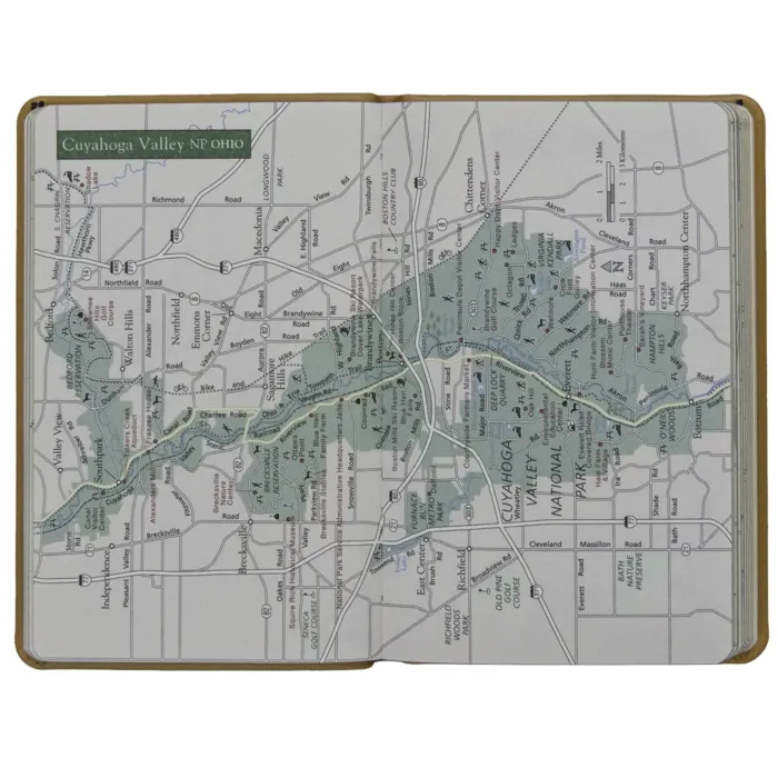 Interior spread featuring a detailed color map of Cuyahoga Valley National Park, Ohio. Map includes roads, rivers, park boundaries, and visitor sites.