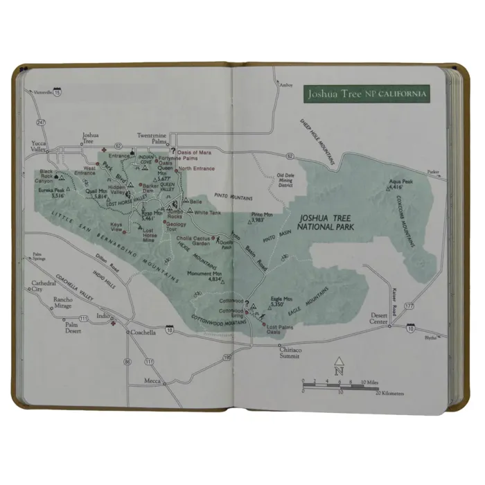 Interior spread with a full-color map of Joshua Tree National Park. Shows entrances, trails, visitor areas, mountains, and roadways