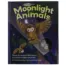 Front cover of the children’s book Moonlight Animals, subtitled “A Lightbeam Book.” The cover features a brown owl flying with wings spread wide under a crescent moon and stars. A child’s hand holds a flashlight that shines a beam of light into the forest, revealing hidden animals, including owls peeking from a tree hollow. The bottom text reads: “Move the magic light beam to find the hidden animals. By Elizabeth Golding, illustrated by Ali Lodge.”