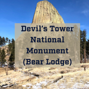 A picture of Devils tower in the snow with the text: Devils Tower National Monument (Bearlodge)
