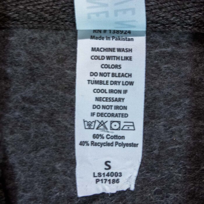 Care label of the Wind Cave hoodie showing 60 percent cotton, 40 percent recycled polyester, size small.