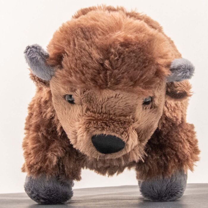 Front view of the Wild Republic plush bison, black nose, brown eyes, gray horns curving up and brown tufted ears
