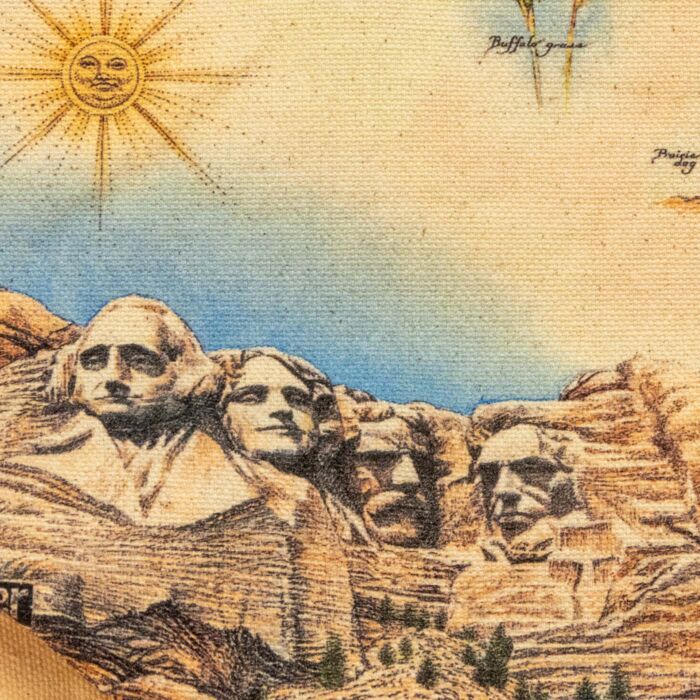 Close-up of the printed Mount Rushmore illustration showing the cotton canvas weave