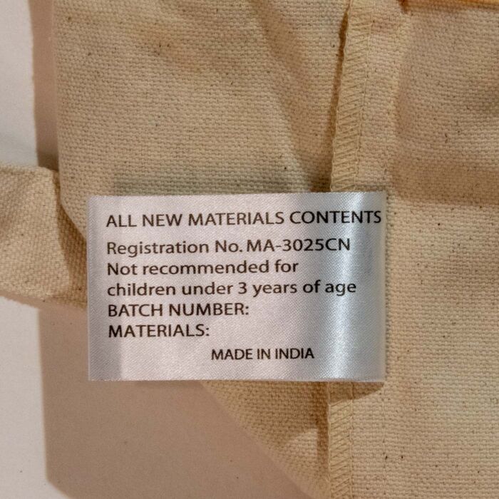 Sewn-in care label reading all new materials contents, made in India
