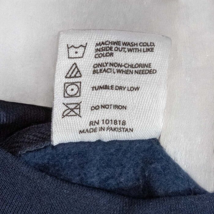 Care label: machine wash cold inside out, tumble dry low, do not iron
