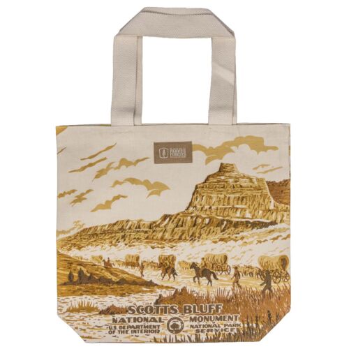 Scotts Bluff National Monument canvas tote bag, front, with a WPA poster style wagon train scene below the bluff