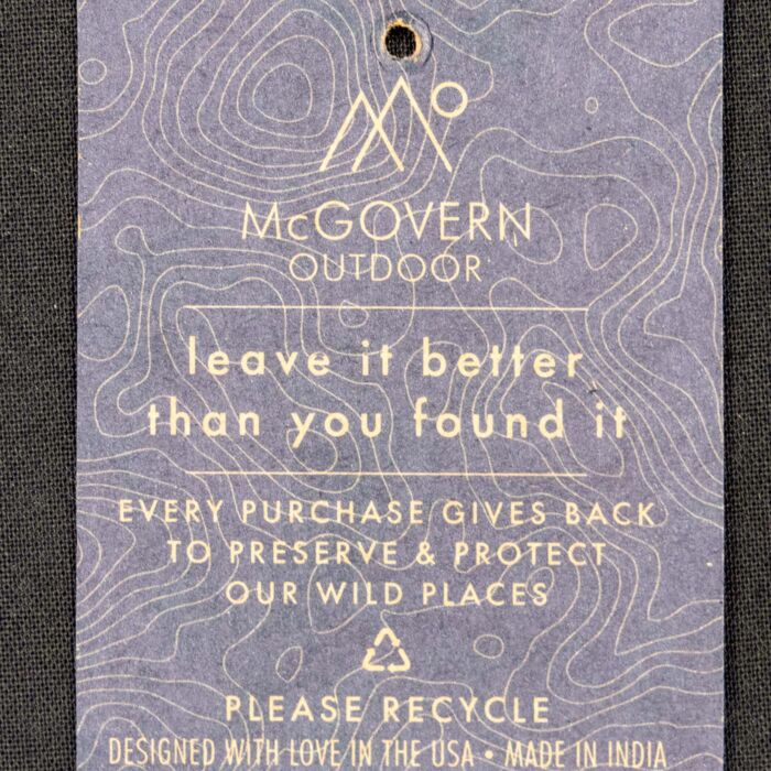 Back of the hang tag on the Scotts Bluff canvas tote bag, reading leave it better than you found it