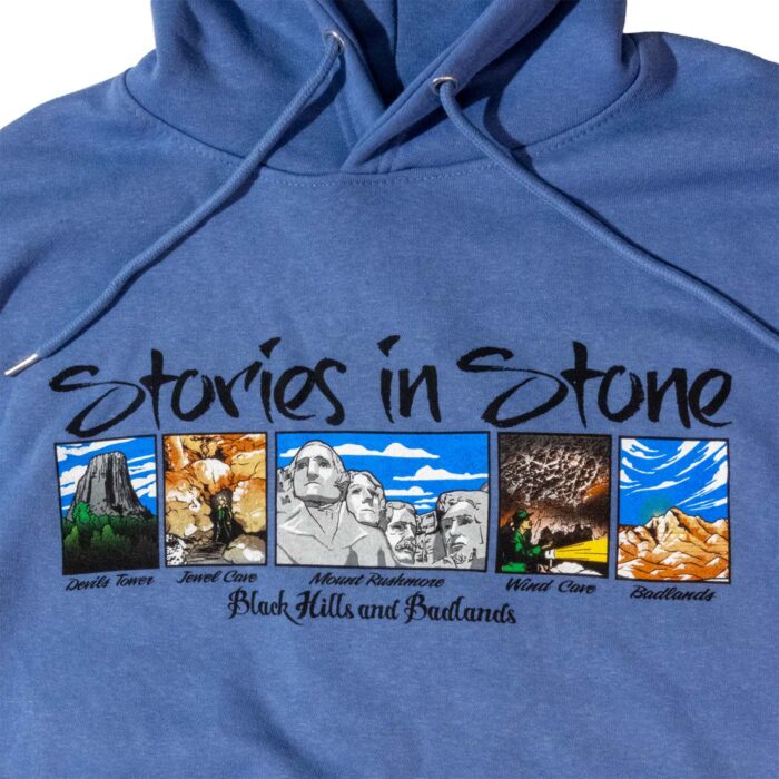 Stories in Stone hoodie front graphic: Devils Tower, Jewel Cave, Mount Rushmore, Wind Cave, and Badlands panels