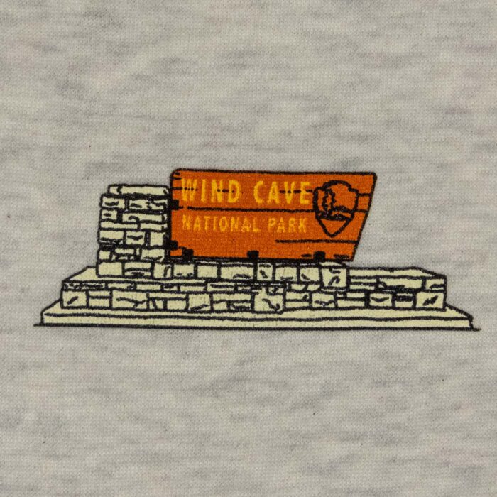 Close-up of the Wind Cave entrance sign chest print