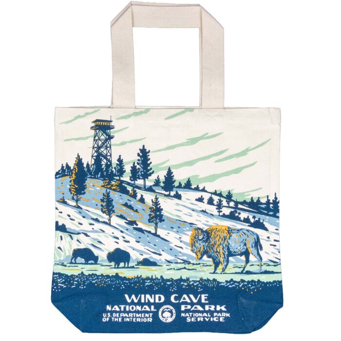 Wind Cave National Park recycled canvas tote bag, bison side, bison grazing on open hills below a fire lookout tower in WPA poster style