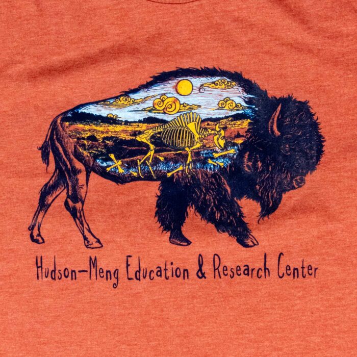 Close-up of the Hudson-Meng bison design showing a bison skeleton inside the bison silhouette on a prairie landscape