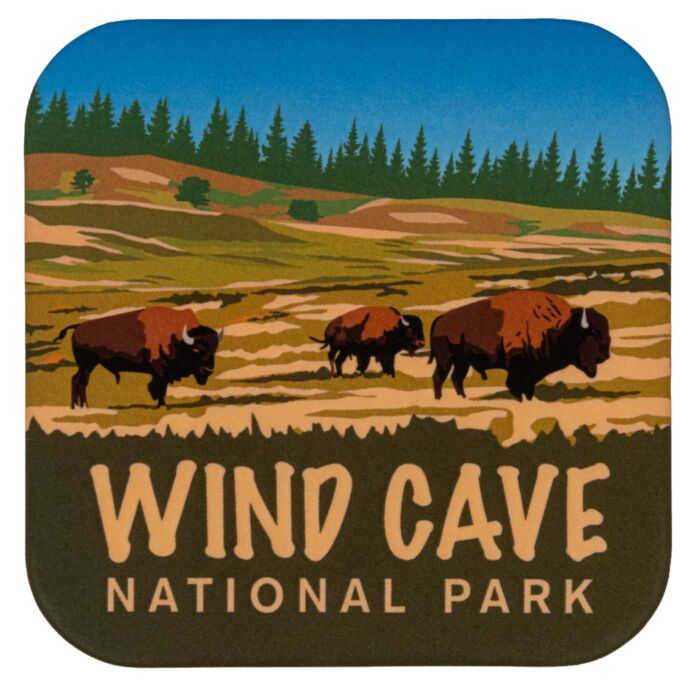 Rounded-square Wind Cave National Park magnet showing three bison on prairie beneath a pine tree line.