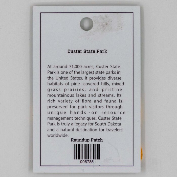 Back of the Buffalo Roundup patch display card with Custer State Park information and SKU