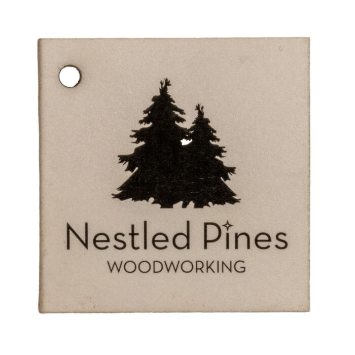 Nestled Pines Woodworking hangtag with pine tree logo
