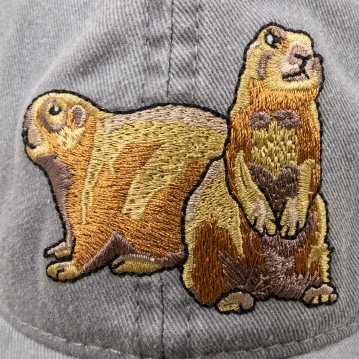 Close-up of the two embroidered prairie dogs on the hat